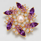 Iida Purple Zircon Pearl Flower Brooch in an oblique front view showing raised settings and dimensional construction.