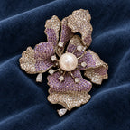 Iiris’s folded lavender zircon petals displayed on slate-blue velvet.