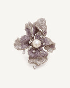 Iiris Lavender Zircon Iris Brooch with curled pavé petals and an imitation pearl centre.
