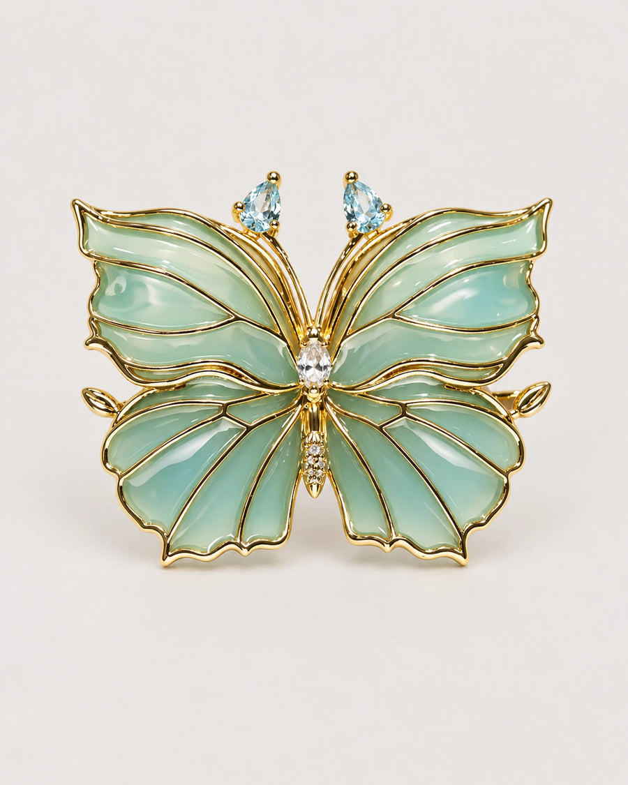 Ilma blue-green translucent enamel butterfly brooch with gold-tone wing veins, front view