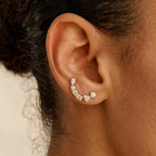 Ilo Smile Pave Stud Earrings worn on ear