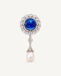 Inari Blue Cabochon Pearl Drop Brooch with a cobalt-blue oval, clear zircon halo and freshwater pearl drop.