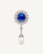 Inari Blue Cabochon Pearl Drop Brooch with a cobalt-blue oval, clear zircon halo and freshwater pearl drop.