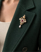 Ingrid Red Crown Drop Brooch — model wearing the brooch on a jacket lapel, close view