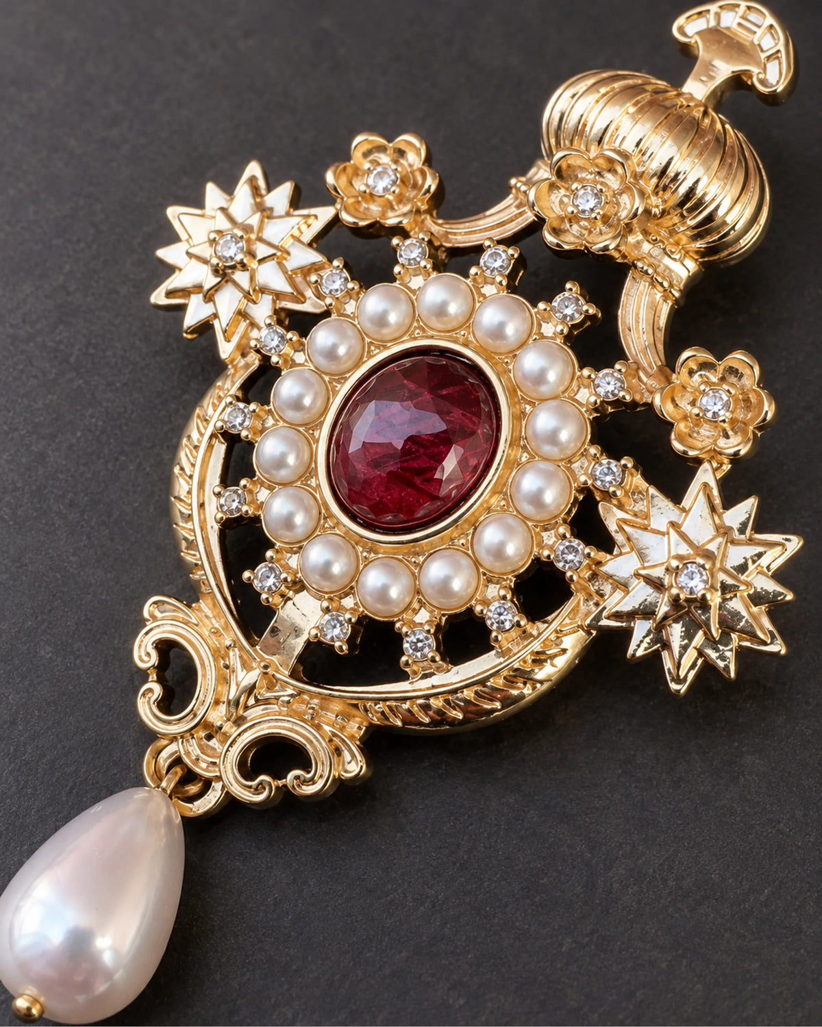 Ingrid Red Crown Drop Brooch — raised ornament and surface details, macro view