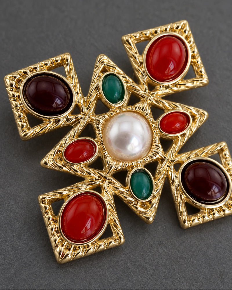 Ivar Red and Green Cross Brooch — raised ornament and surface details, macro view