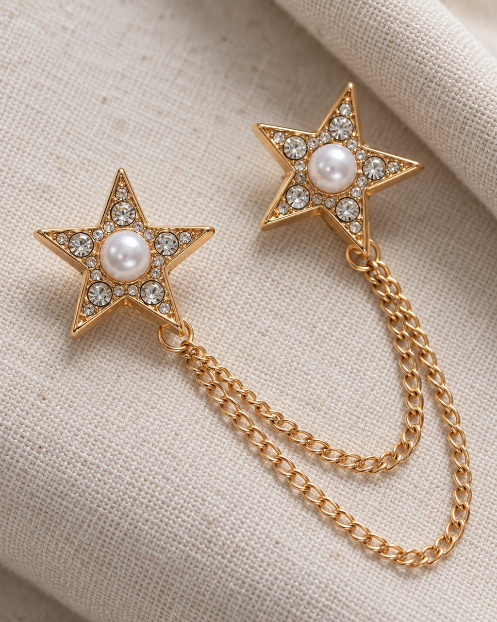 Kaksi Twin Star Lapel Chain Brooch in gold-tone finish; motif and chain detail