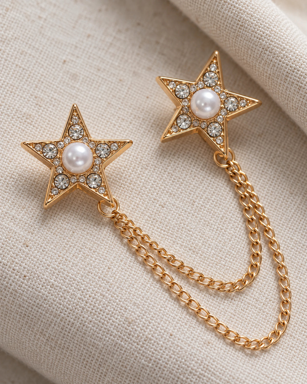Kaksi Twin Star Lapel Chain Brooch in gold-tone finish; motif and chain detail