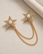 Kaksi Twin Star Lapel Chain Brooch in gold-tone finish; complete still-life drape
