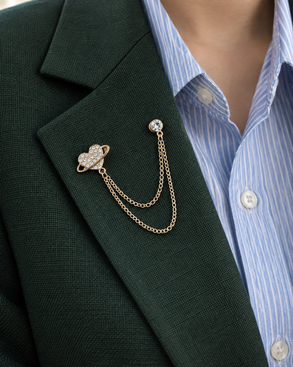 Keha Orbit Heart Lapel Chain Brooch in gold-tone finish; close wearing view on a structured lapel