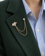 Keha Orbit Heart Lapel Chain Brooch in gold-tone finish; close wearing view on a structured lapel