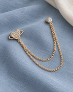 Keha Orbit Heart Lapel Chain Brooch in gold-tone finish; complete still-life drape