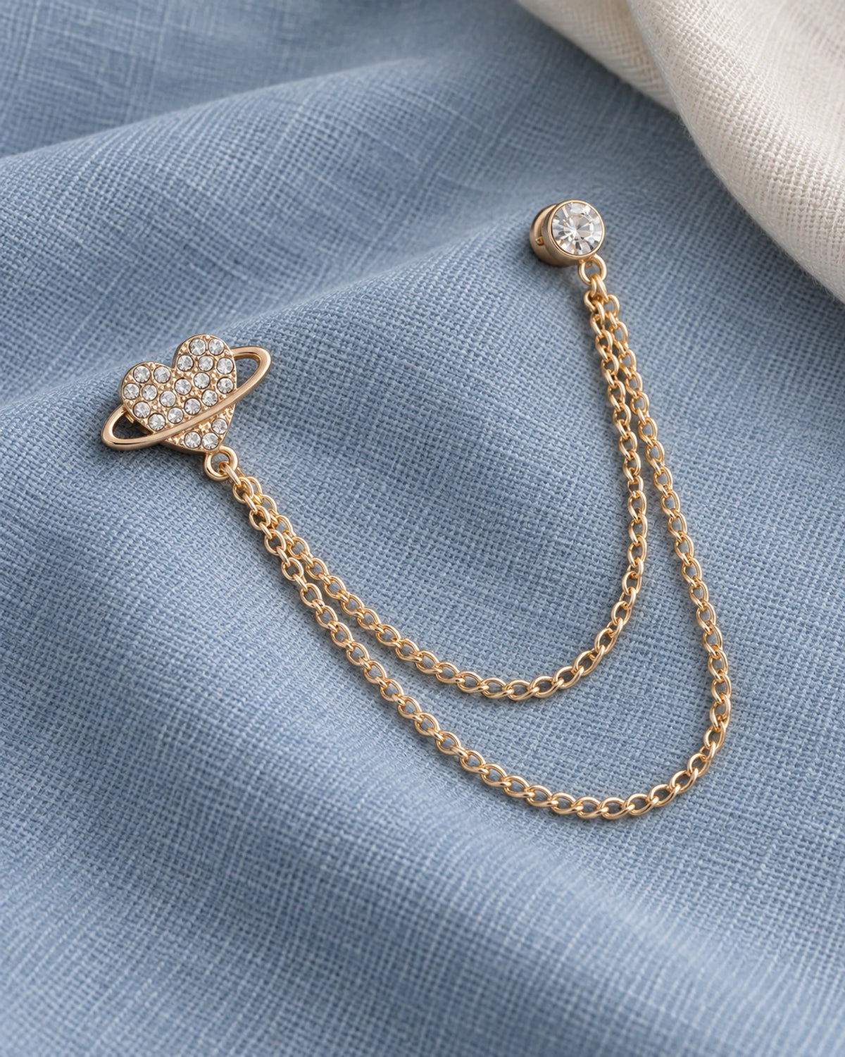 Keha Orbit Heart Lapel Chain Brooch in gold-tone finish; complete still-life drape