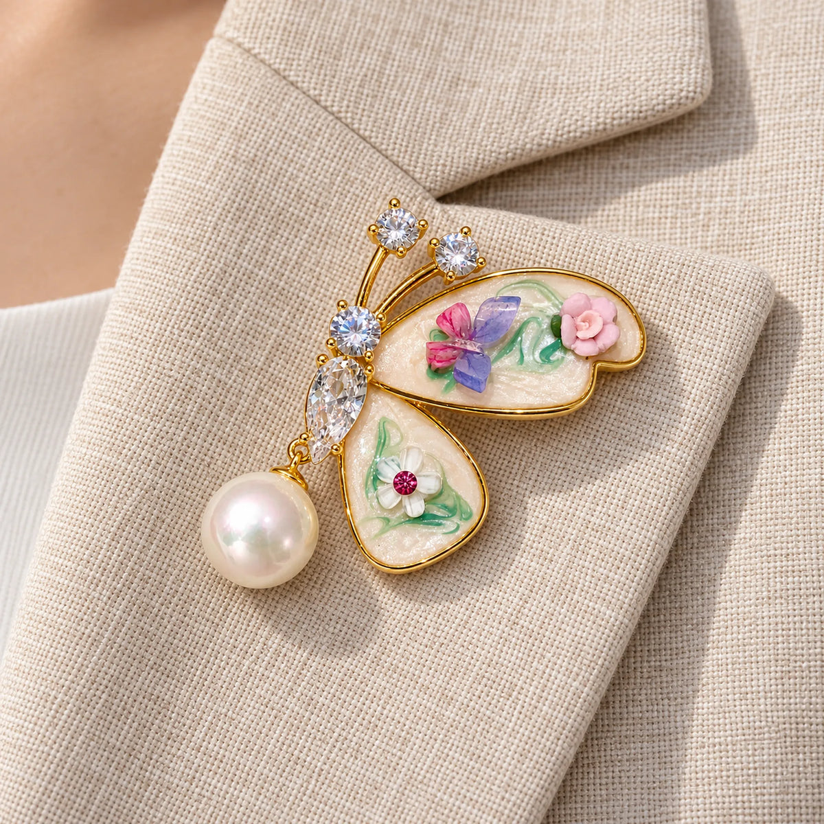 Kielo butterfly brooch pinned fully to a folded oatmeal linen lapel.