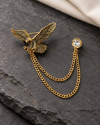 Kotka Eagle Lapel Chain Brooch in gold-tone finish; complete still-life drape