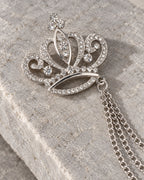 Kruunu Openwork Crown Lapel Chain Brooch in silver-tone finish; motif and chain detail
