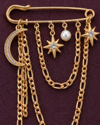 Kuutar Moon and Star Safety Pin Brooch in gold-tone finish — detail study of the motif and chains