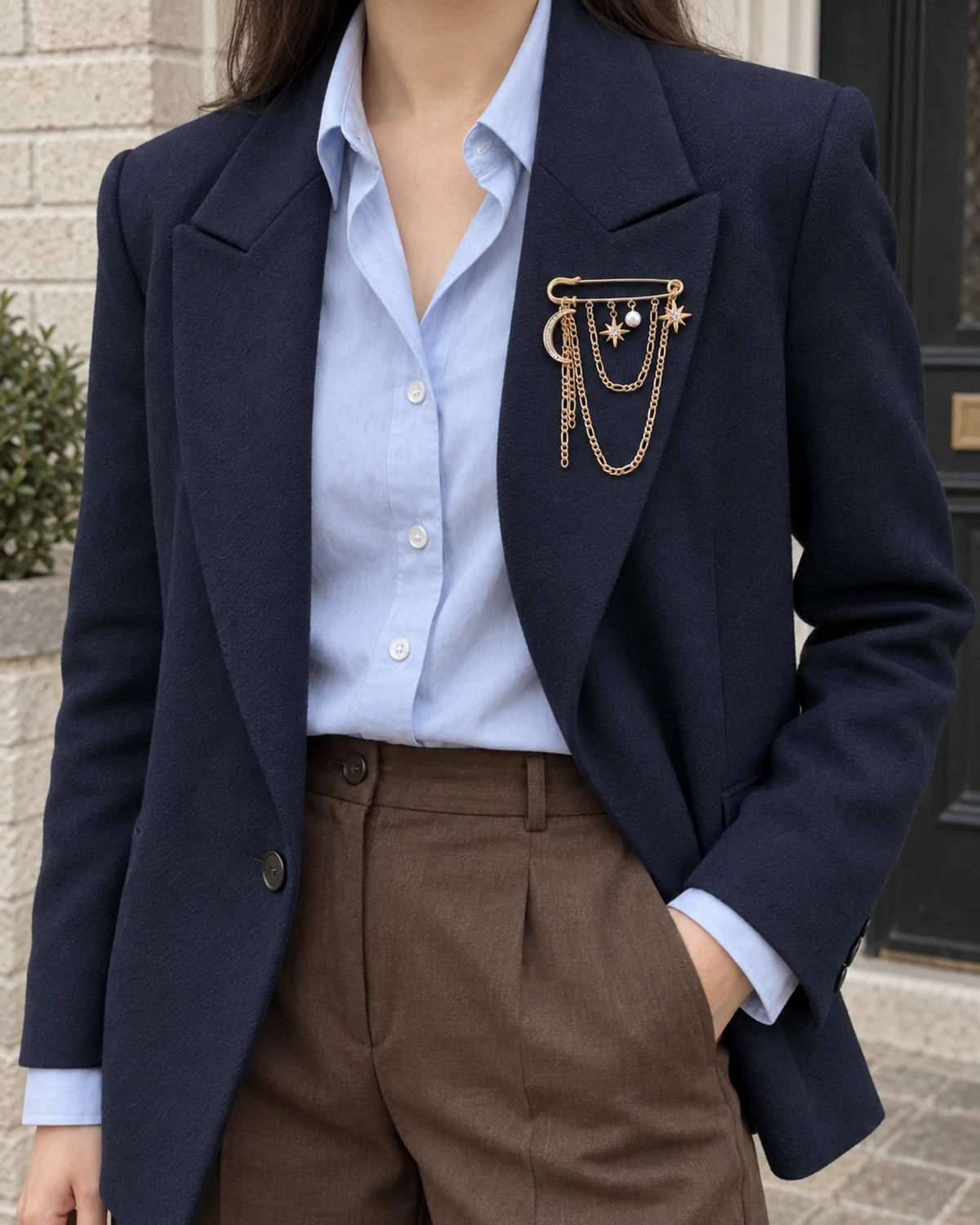 Kuutar Moon and Star Safety Pin Brooch in gold-tone finish — wider wearing view with neutral tailoring