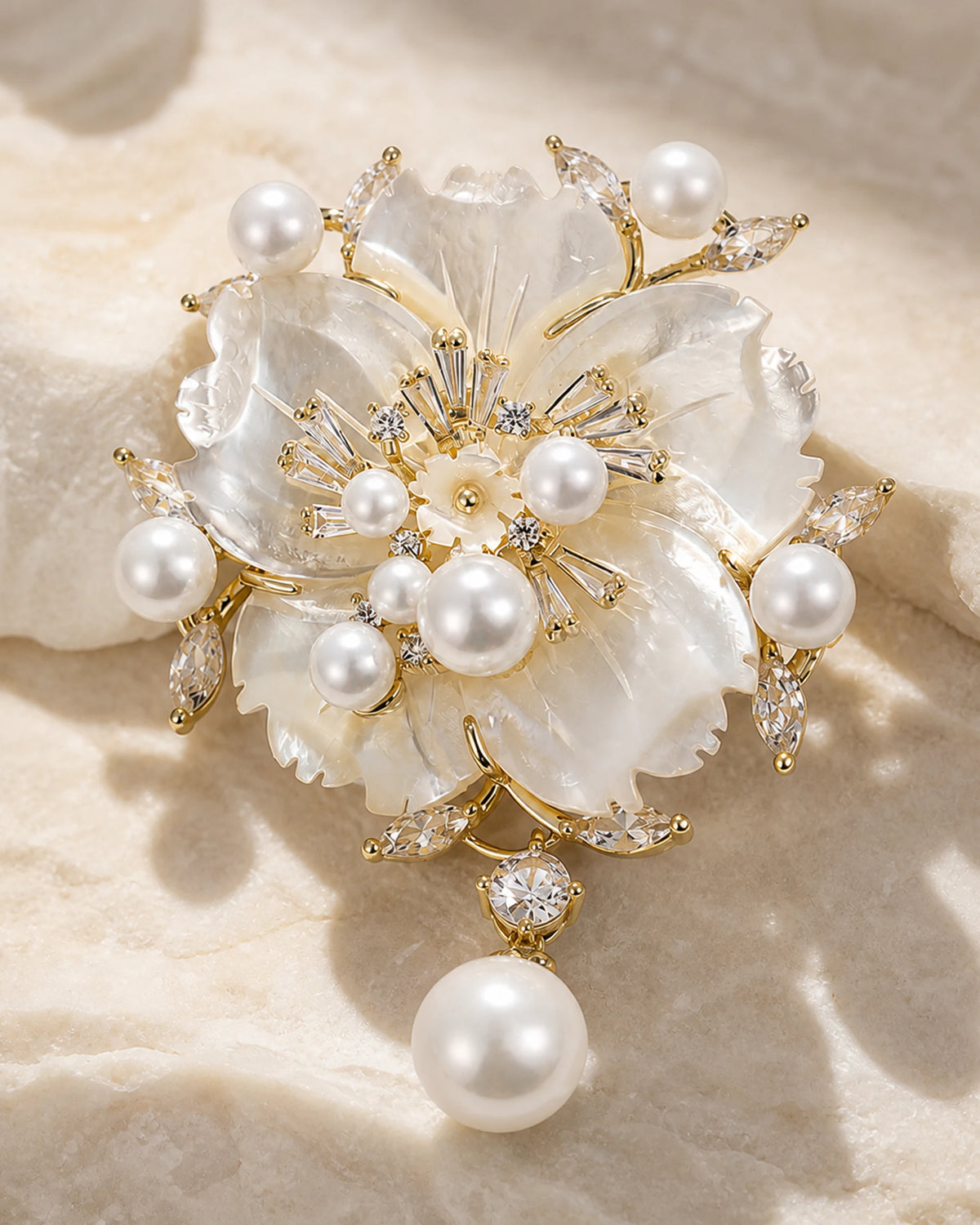 Macro view of Linnea Brooch natural shell petals, freshwater pearls and clear zircon accents