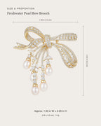 Bow brooch size: approximately 1.93 inches wide by 2.05 inches high, or 4.9 by 5.2 centimeters