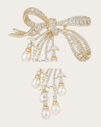 Close details of the clear-stone ribbon bow and freshwater pearl drop connectors