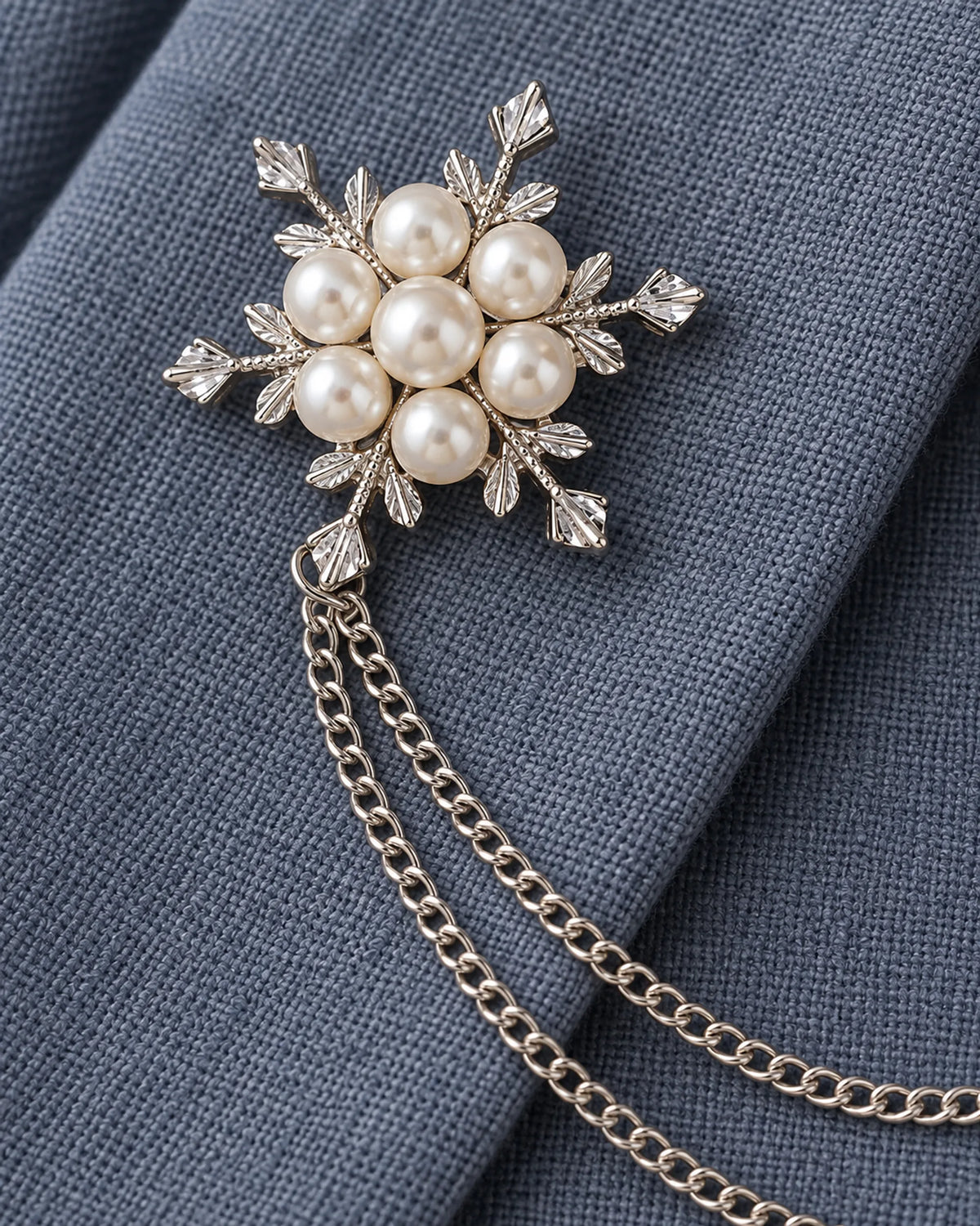 Lume Snowflake Lapel Chain Brooch in silver-tone finish; motif and chain detail