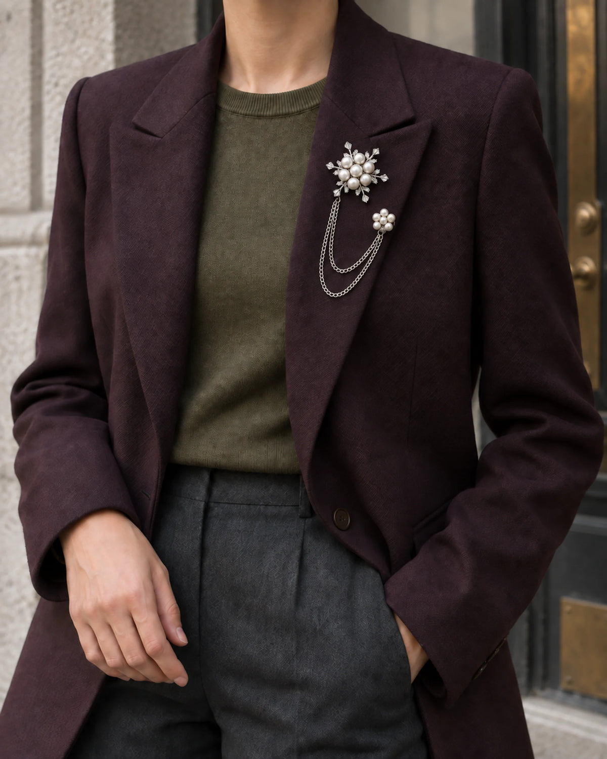 Lume Snowflake Lapel Chain Brooch in silver-tone finish; wider faceless jacket styling