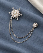 Lume Snowflake Lapel Chain Brooch in silver-tone finish; complete still-life drape
