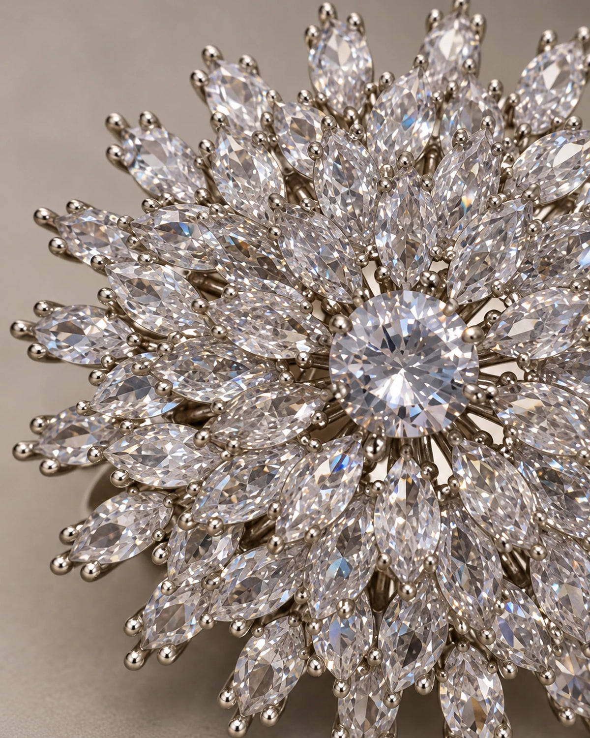 Detail of Lumi layered clear marquise zircon rays and round center stone