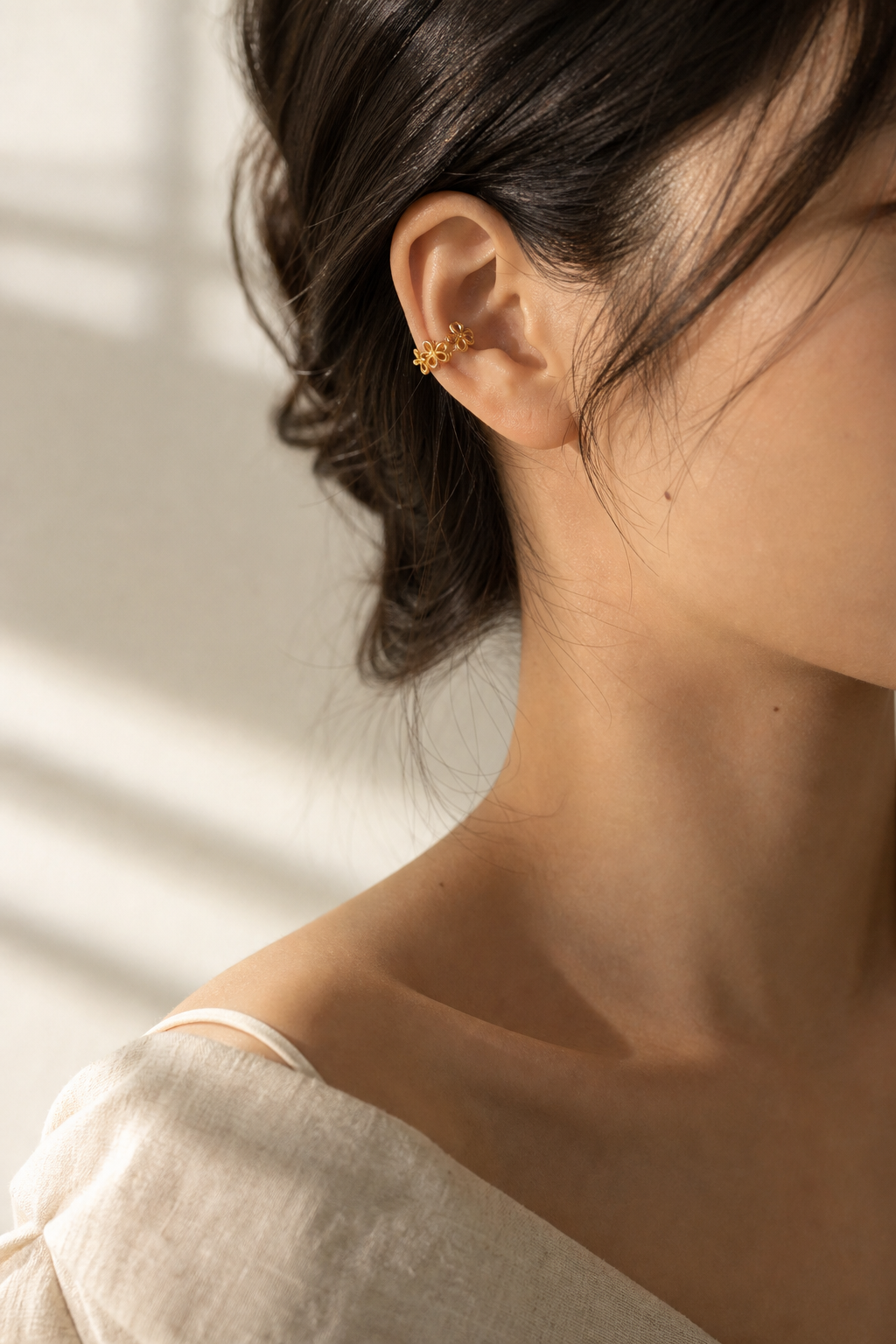 Lumme Bloom Ear Cuff Earrings worn in soft window light