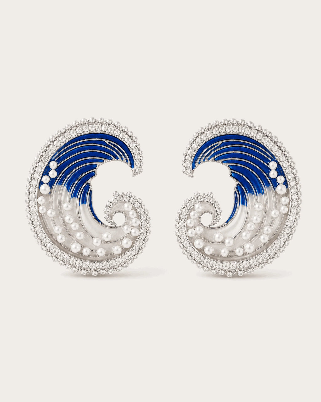 Marea Crystal Wave Stud Earrings in Silver Tone on a soft blush background