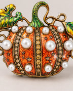 Rounded white pearl-style beads alternate with crystal-set ribs across the Orange pumpkin.