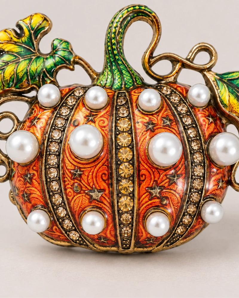 Rounded white pearl-style beads alternate with crystal-set ribs across the Orange pumpkin.