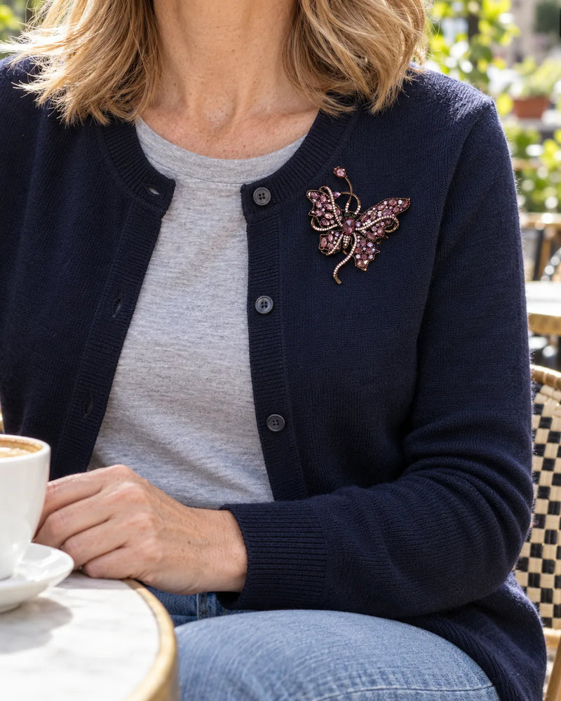 Nemi Smoky Purple Butterfly Brooch fastened at its verified size to a supported pale blue-grey wool scarf fold.