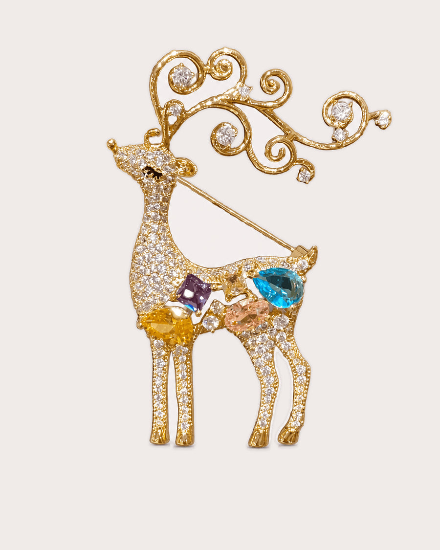 Niva standing deer brooch with curled antlers, colored stones and its diagonal pin.