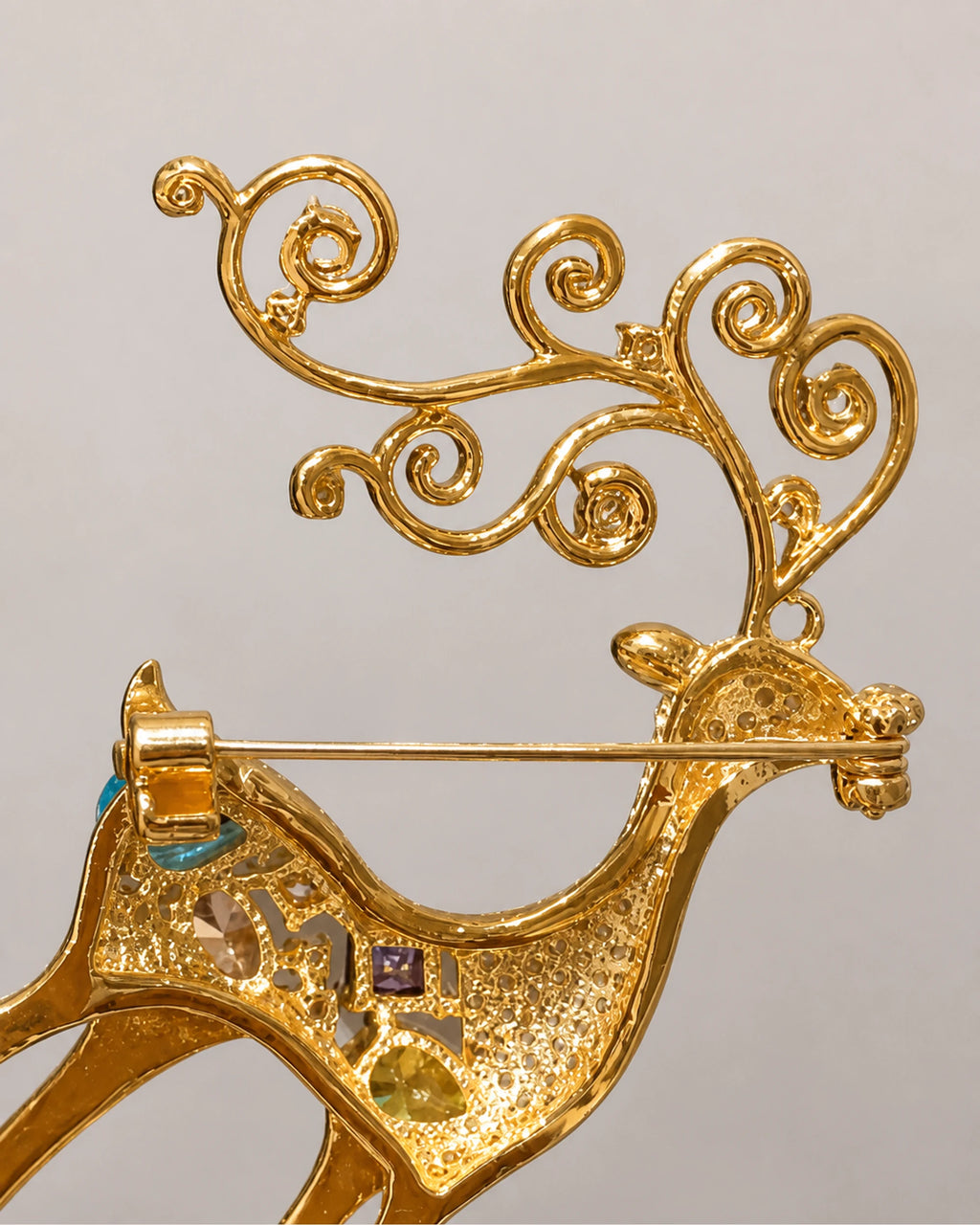 Rear detail of Niva's hinged pin and open scroll-antler construction.