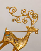Rear detail of Niva's hinged pin and open scroll-antler construction.