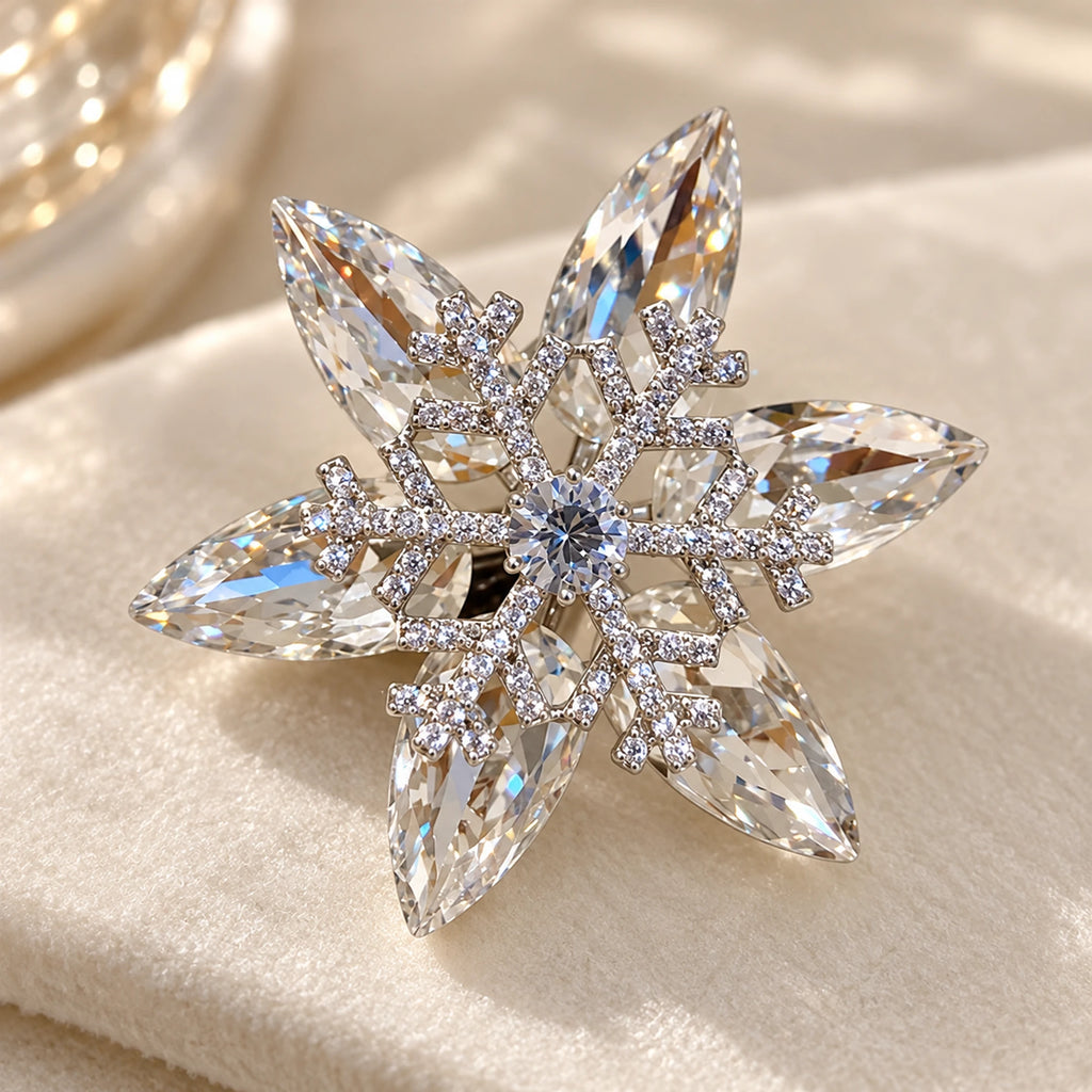 The small zircon-set snowflake overlaps six clear marquise K9 crystal points.