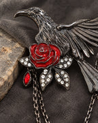 Detail of Noctra red rose, four clear-stone leaves and gunmetal-tone feathers