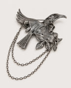 Back of Noctra bird and rose brooch showing one hinged pin and two chains
