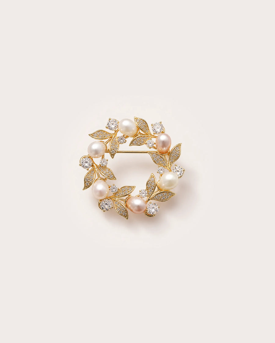 Olea Freshwater Pearl Wreath Brooch on a warm pale studio background with a natural contact shadow