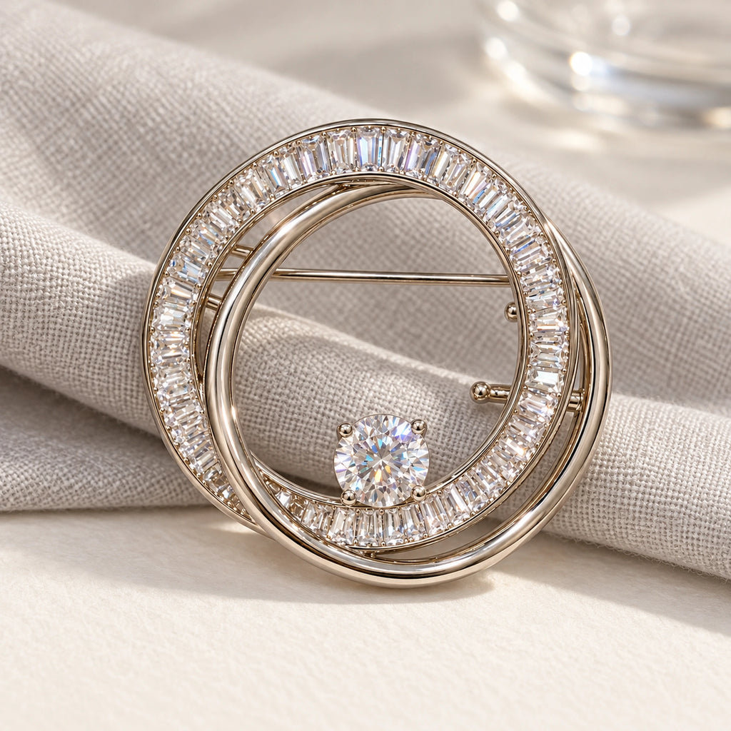 Complete Oona Baguette Zircon Double-Loop Brooch in an original still life on paper and linen.