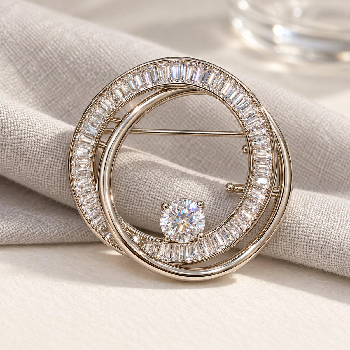 Complete Oona Baguette Zircon Double-Loop Brooch in an original still life on paper and linen.