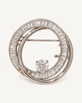 Oona Baguette Zircon Double-Loop Brooch shown complete on a warm plain background.