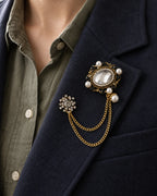 Ova Oval Beaded Lapel Chain Brooch in gold-tone finish; close wearing view on a structured lapel