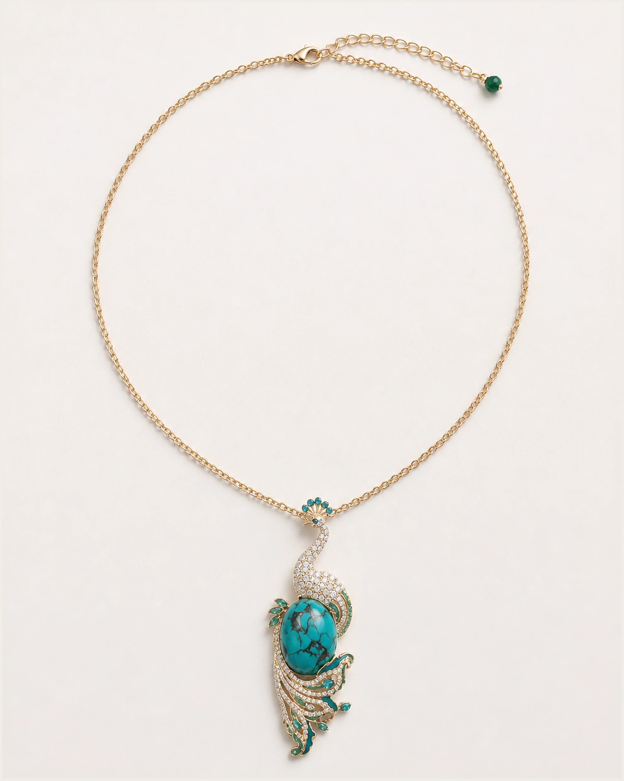 Pava Turquoise-Tone Peacock Pendant Necklace on an exact #F0EBE9 studio background with natural contact shadow.
