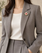 Pihla Pavé Flower Magnetic Brooch, Gold & Red worn with a grey jacket, wider styling view