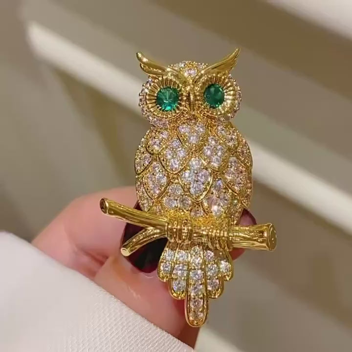 Oiva Green-Eyed Zircon Owl Brooch in motion.