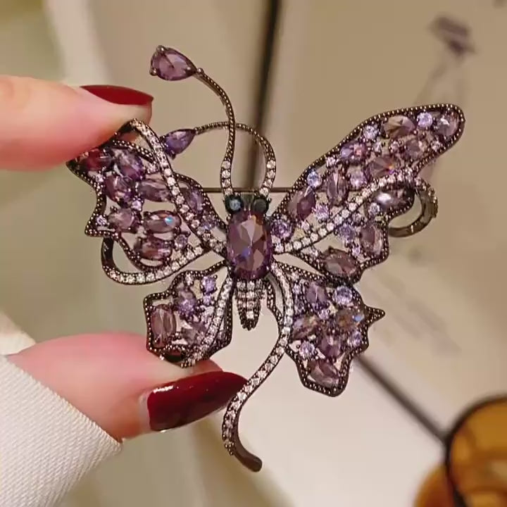 Nemi Smoky Purple Butterfly Brooch in motion; silent square close-up.