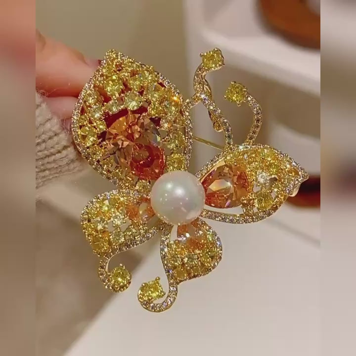 Kaisa Champagne Zircon Butterfly Brooch shown from several angles in a silent product film.
